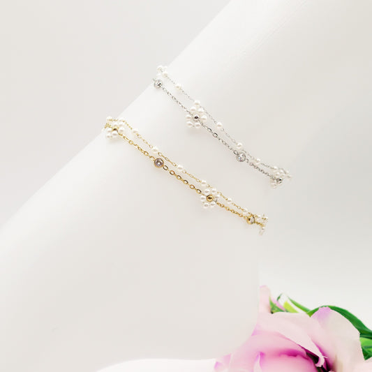 DAISY PEARLS ~ ACCIAIO INOSSIDABILE ~ Cavigliera con fiori, zirconi e perline