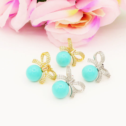 CALLA Turquoise ~ Orecchini bottone con fiocco zirconato