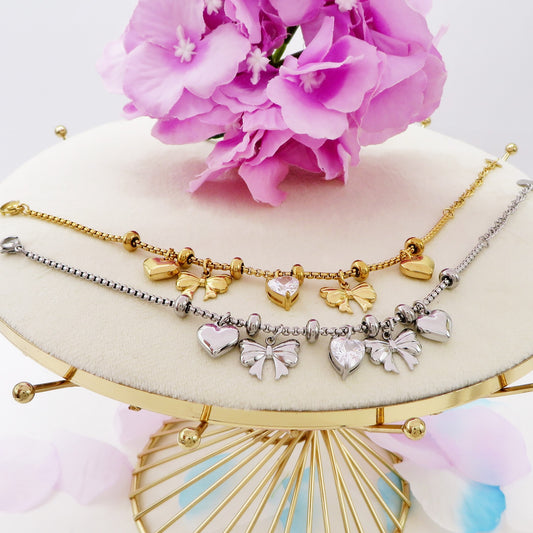 WALDORF - Bracciale con fiocchi e cuori pendenti bombe' ACCIAIO INOSSIDABILE