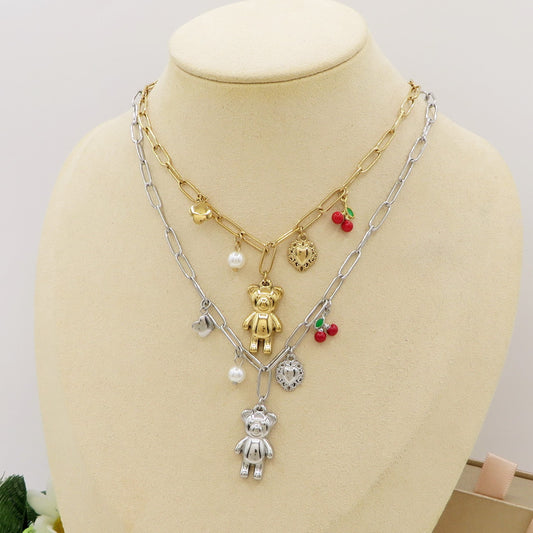 CHERRY TEDDY Collana - ACCIAIO inossidabile - Collana catena charms orsetto, ciligie, cuore sacro