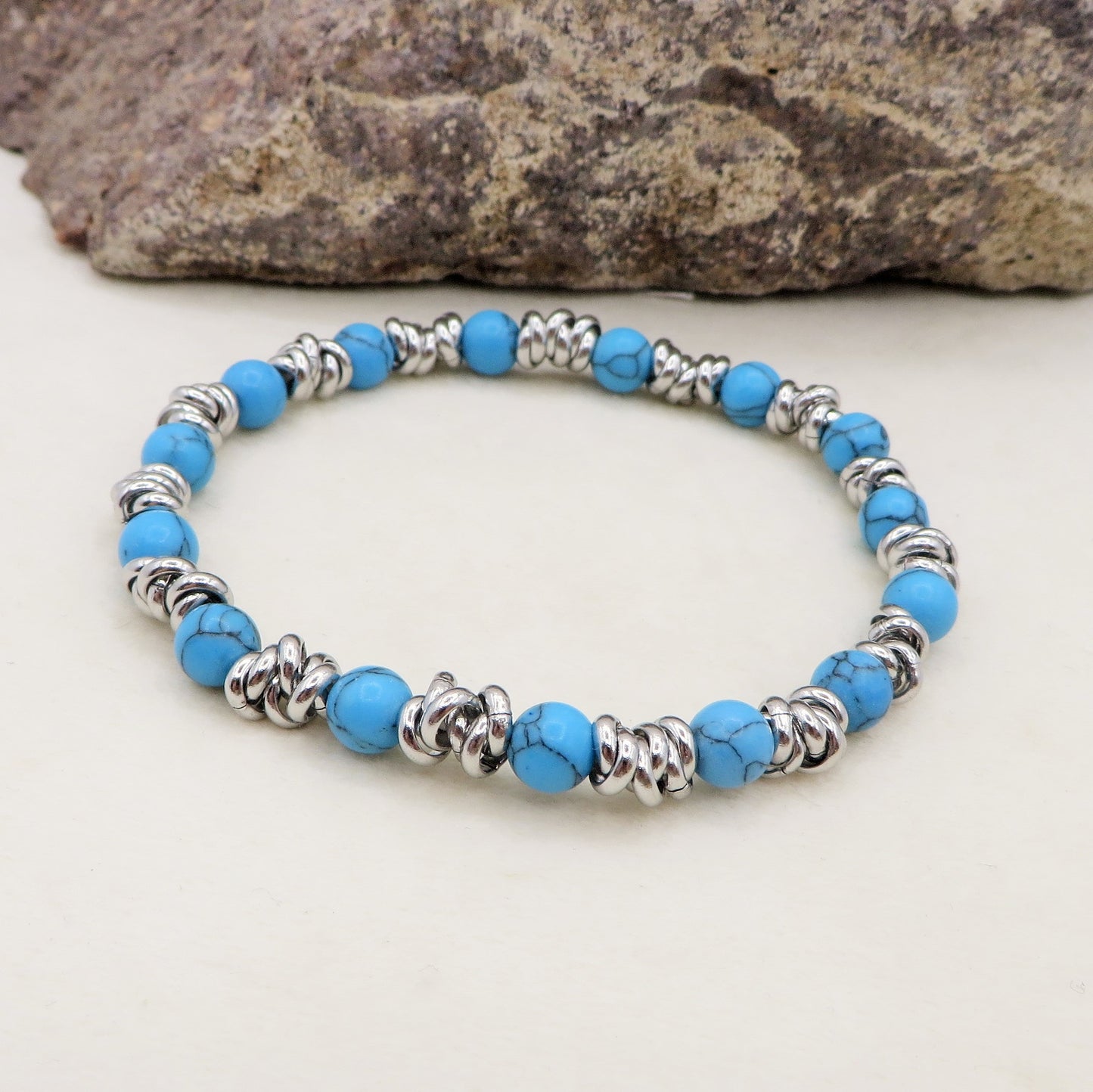 Bracciale unisex elasticizzato NODINI ACCIAIO INOSSIDABILE + perle colours