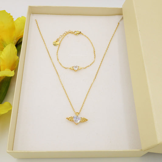 ANGEL SET - Acciaio Inossidabile- collana e bracciale con pendente cuore con ali in cubic zirconia