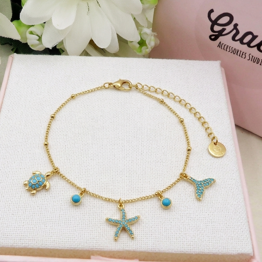 ARUBA ~ Cavigliera con charms marini in ACCIAIO INOSSIDABILE 316L + cubic zirconia tartaruga, delfino, stella marina