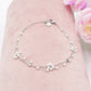 DAISY PEARLS ~ ACCIAIO INOSSIDABILE ~ Cavigliera con fiori, zirconi e perline