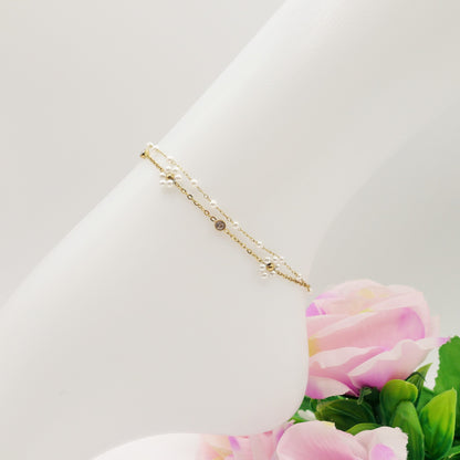 DAISY PEARLS ~ ACCIAIO INOSSIDABILE ~ Cavigliera con fiori, zirconi e perline