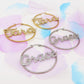 BRILLIANT big hoops - NOME PERSONALIZZATO Paio orecchini a cerchio in Acciaio Inossidabile