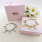 TEDDY CLOVER - Bracciale con orsetti, quadrifoglio e cuori pendenti bombe' ACCIAIO INOSSIDABILE