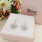 DAISY LUXE - Orecchini in ACCIAIO INOSSIDABILE a monachella con fiori in cubic zirconia