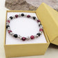 Bracciale unisex elasticizzato NODINI ACCIAIO INOSSIDABILE + perle colours