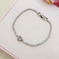 AURORA slim ~ ACCIAIO INOSSIDABILE - Bracciale tennis in cubic zirconia con cuore centrale