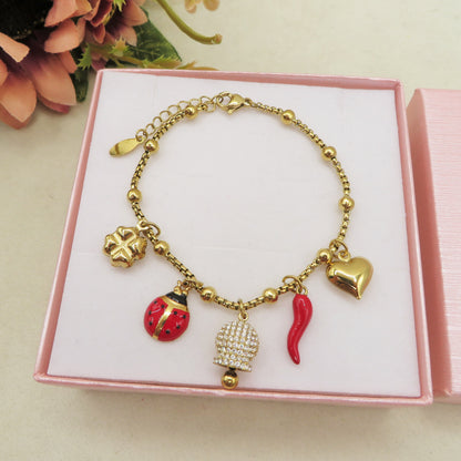 TINKERBELL SHINE LUCKY - Bracciale con campanella zirconata, corno, cuùuore bombè con sonagli, coccinella, quadrifoglio  IN ACCIAIO INOSSIDABILE + cubic zirconia