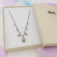 MIRABELLE - ACCIAIO INOSSIDABILE- Collana con campanella e stelline + cubic zirconia