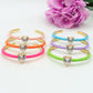 CHERIE FLUO - BRACCIALE RIGIDO SMALTATO CON CUBIC ZIRCONIA A FORMA DI CUORE