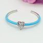 CHERIE FLUO - BRACCIALE RIGIDO SMALTATO CON CUBIC ZIRCONIA A FORMA DI CUORE