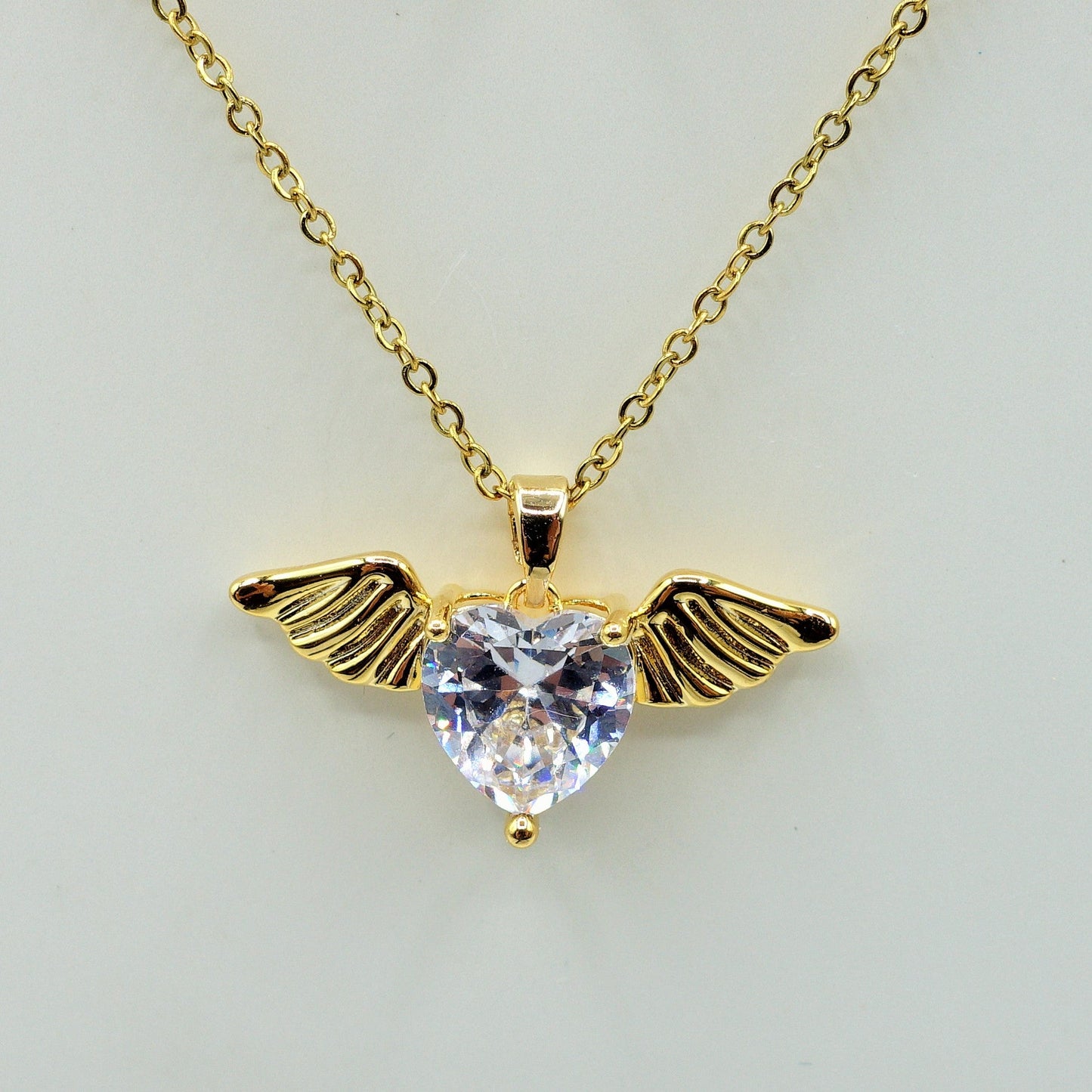 ANGEL SET - Acciaio Inossidabile- collana e bracciale con pendente cuore con ali in cubic zirconia