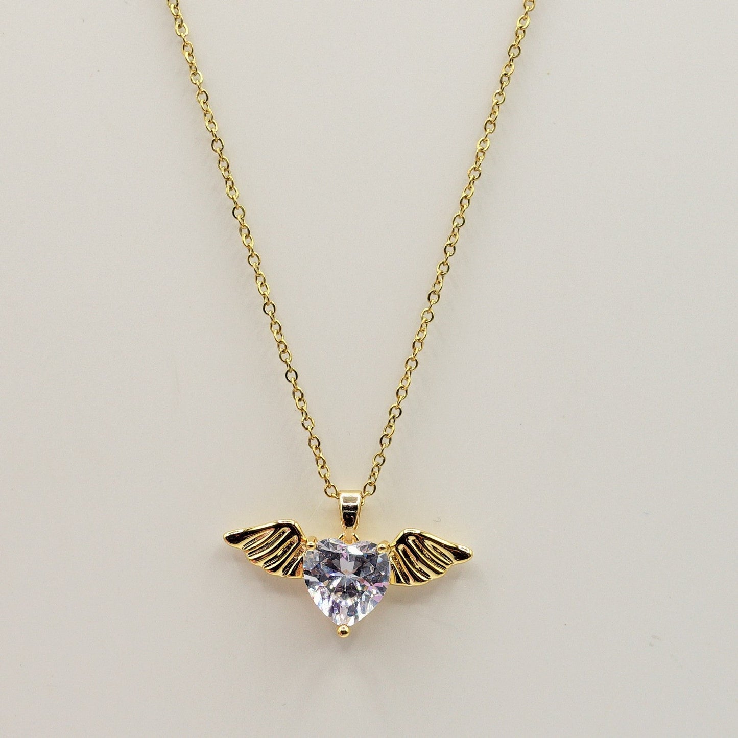 ANGEL SET - Acciaio Inossidabile- collana e bracciale con pendente cuore con ali in cubic zirconia