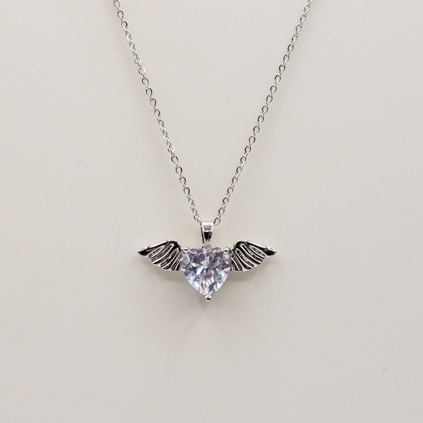 ANGEL - ACCIAIO INOSSIDABILE- collana con pendente CUORE con ali in cubic zirconia