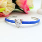 CHERIE FLUO - BRACCIALE RIGIDO SMALTATO CON CUBIC ZIRCONIA A FORMA DI CUORE