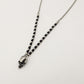 Collana pallini bruniti pendente SKULL  uomo ACCIAIO
