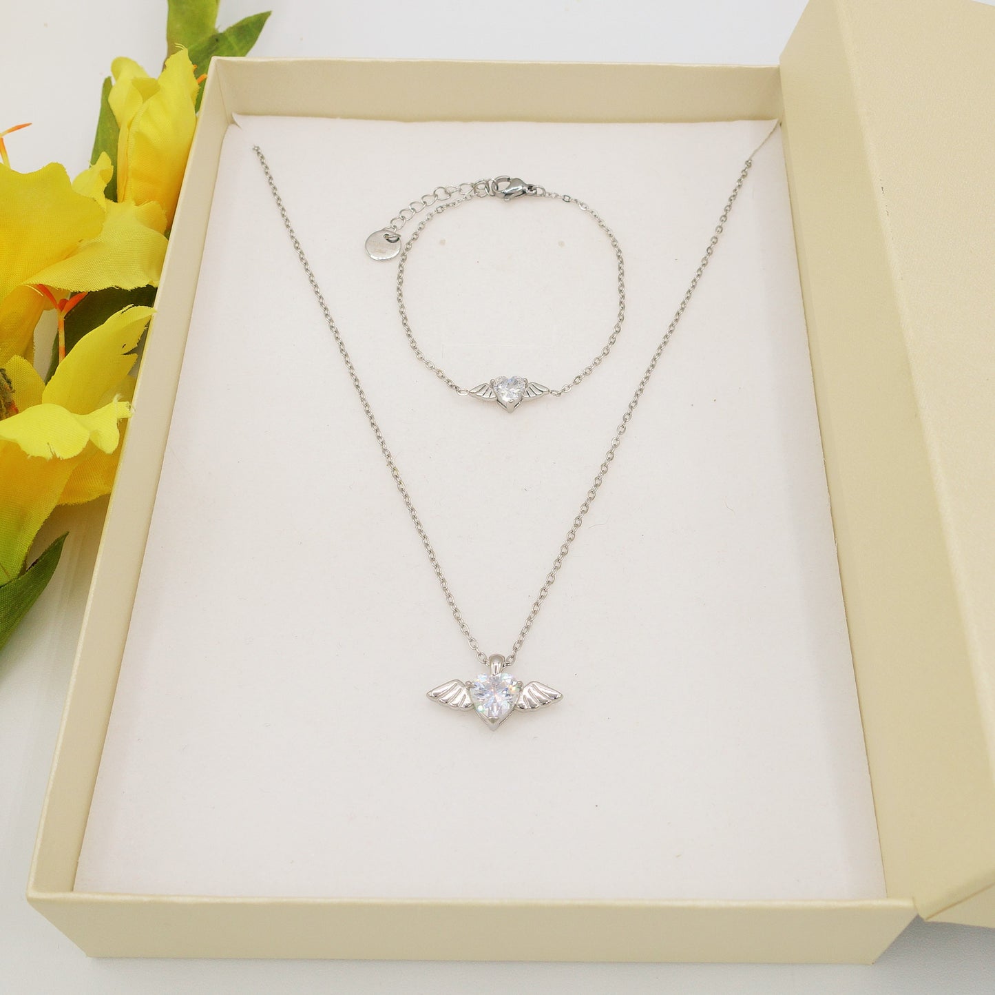 ANGEL SET - Acciaio Inossidabile- collana e bracciale con pendente cuore con ali in cubic zirconia